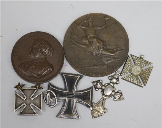 A World War I German iron cross, three other crosses, Handel medal and 1900 exposition medal